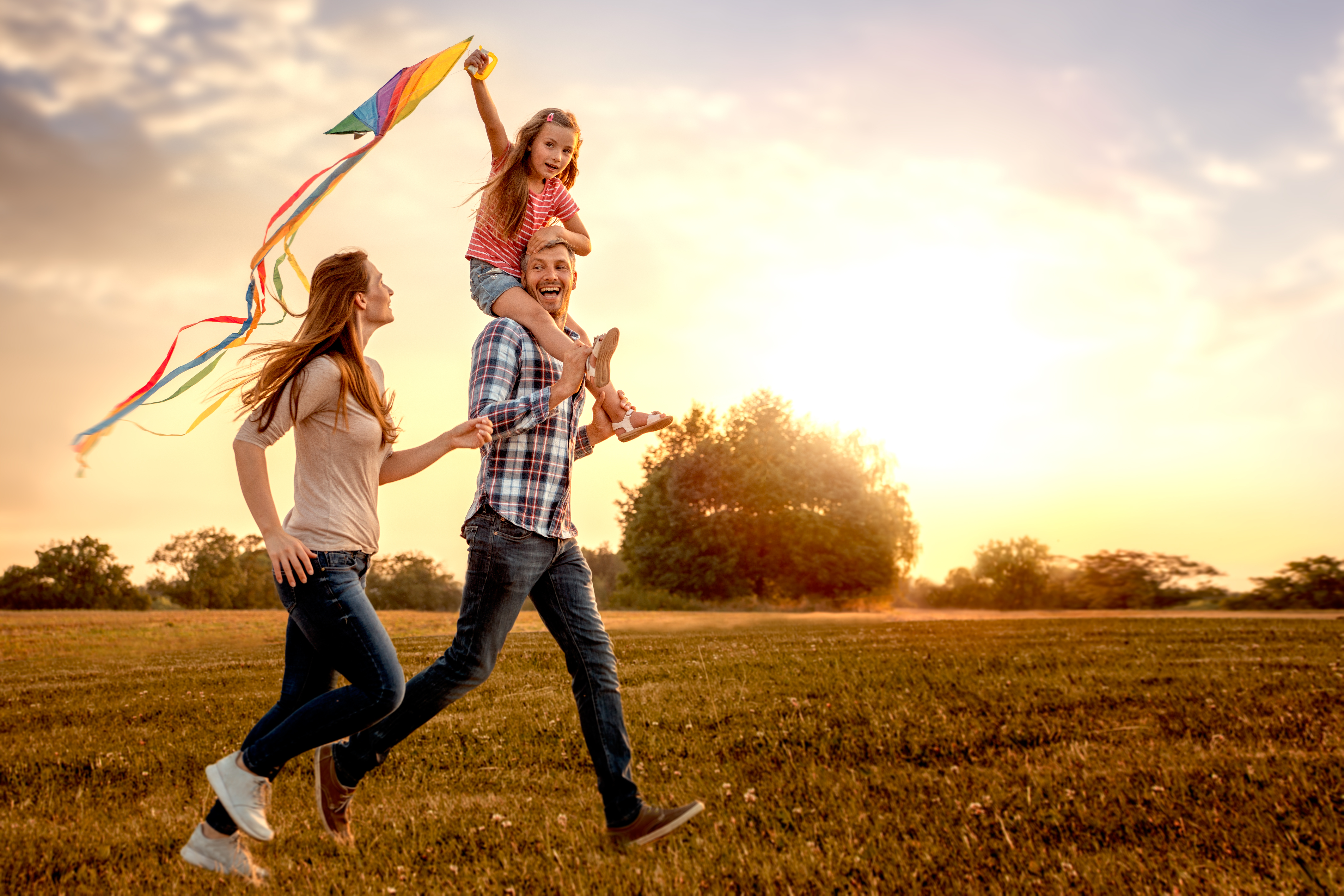 Family flying a kite, featured in the Squirrel Mortgages case study