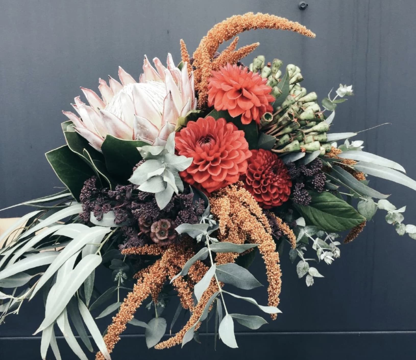 Orange, white and burgundy flower arrangement featured in The Botanist case study